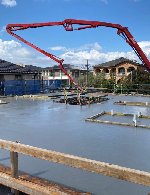 Boom pump on site pouring an engineered slab